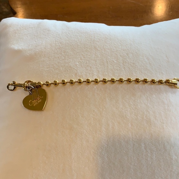 Coach heart charm bracelet in gold
